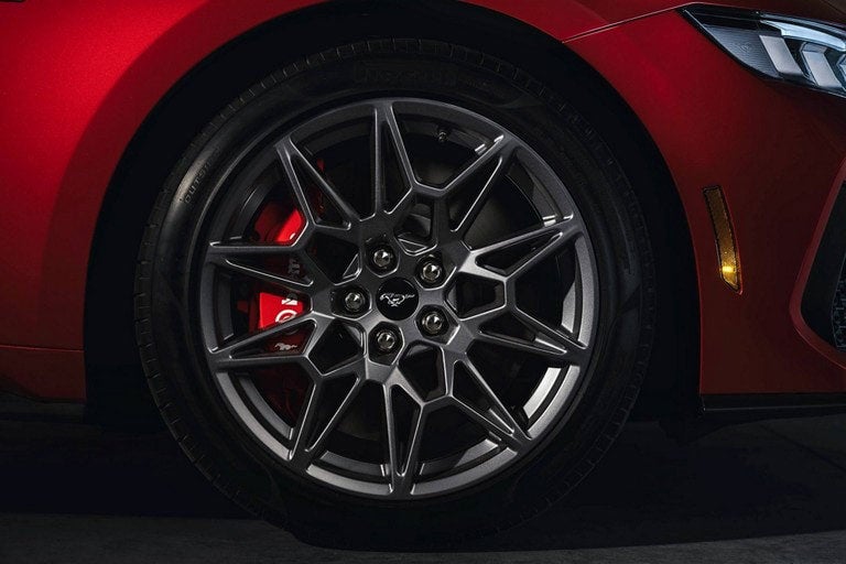 2024 Ford Mustang® model with a close-up of a wheel and brake caliper | Bob Poynter Ford, Inc. in Seymour IN